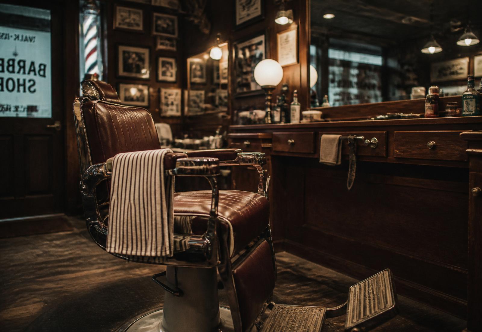 Vintage leather barber chair inside a warmly lit barber shop